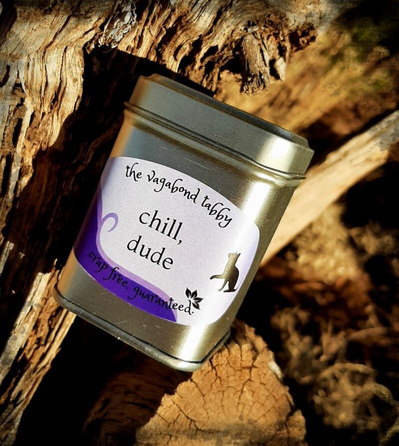A stainless steel tea tin; the label says "chill, dude".