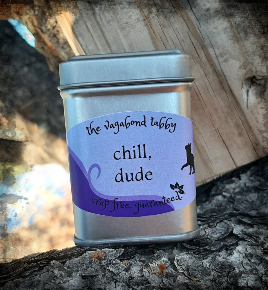 A stainless steel tea tin; the label says "chill, dude".