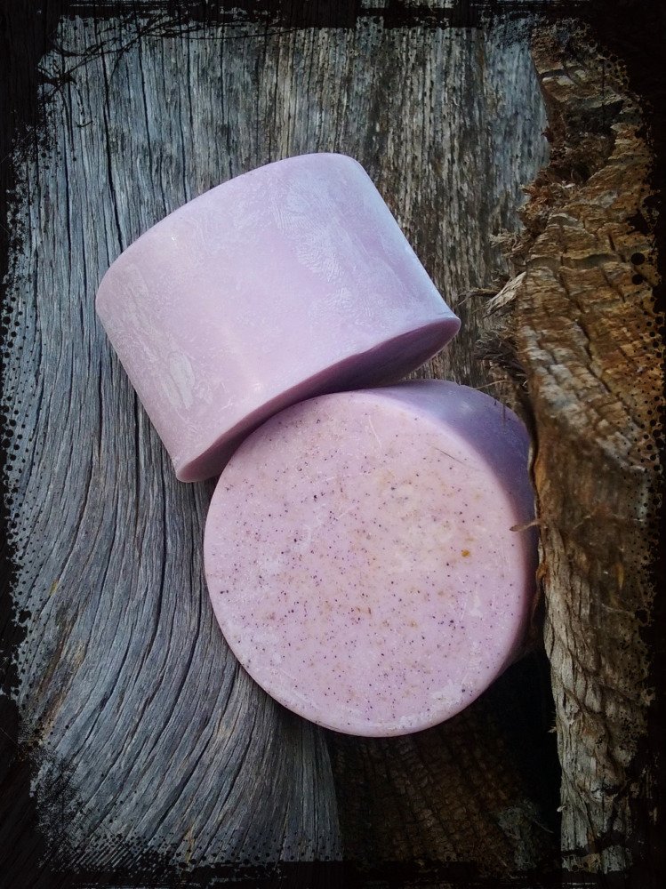 Two round bars of pink soap.