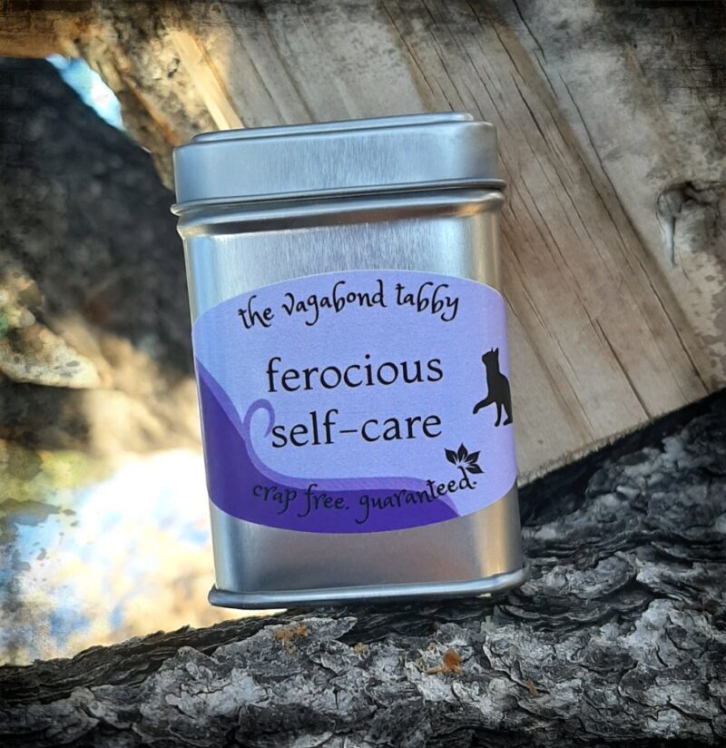 A stainless steel tea tin; the label says "ferocious self-care".