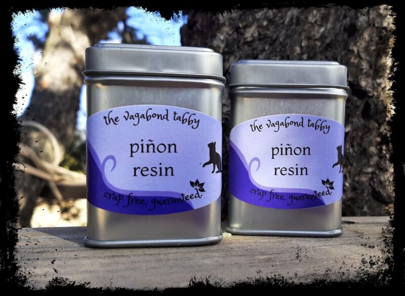 Two stainless steel tins; the label on each says 'pinyon resin'.