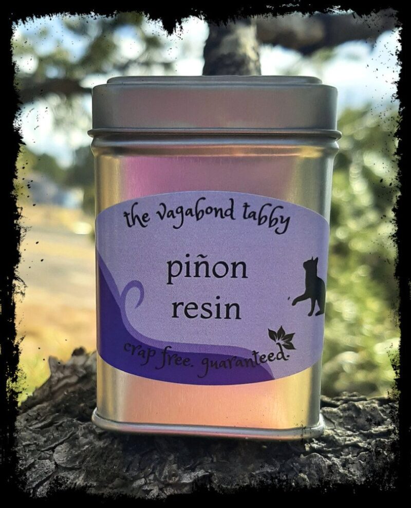 A stainless steel tin; the label says 'pinyon resin'.