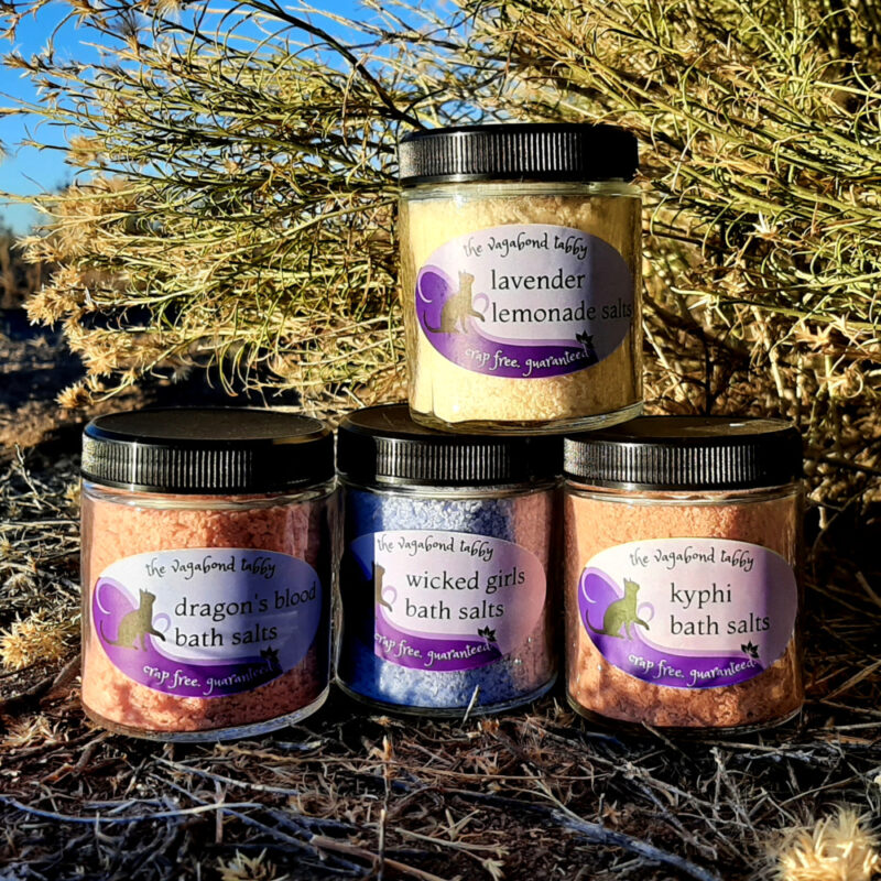 Four jars of bath salts, in four different colors.