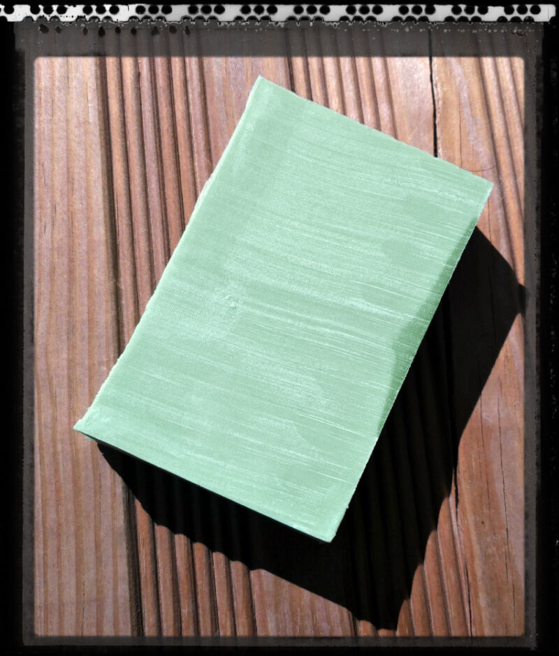 A single bar of yellowish-green soap.