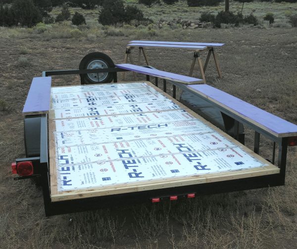 The trailer bed, seen from behind. All the insulation is installed but only some of it is taped down.