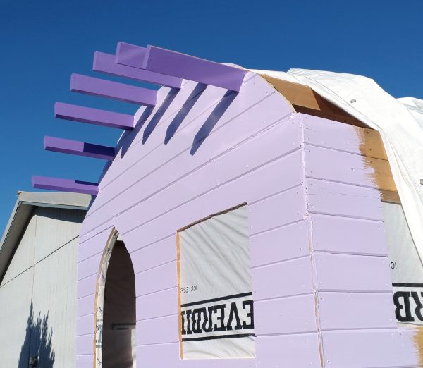 The front of the tinker's wagon, seen slightly from the side. The rafters are now a nice even purple, & about a foot of the side wall has been painted along the corner.