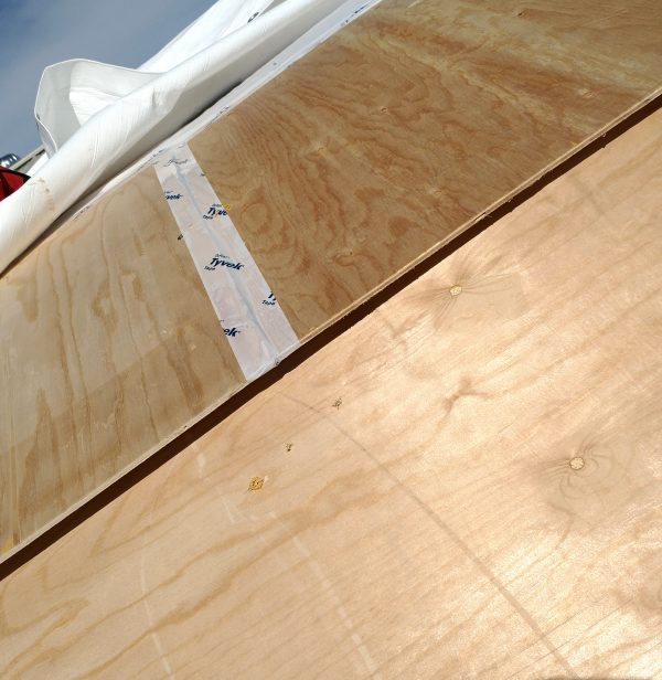 A section of the roof of the tinker's wagon. One layer of plywood overlaps another, but the edge of it sticks out instead of laying smoothly along the curve.