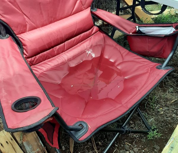 My red camping chair, which very usefully has a puddle on the seat about two inches deep.