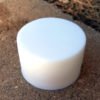 A single round bar of white soap.